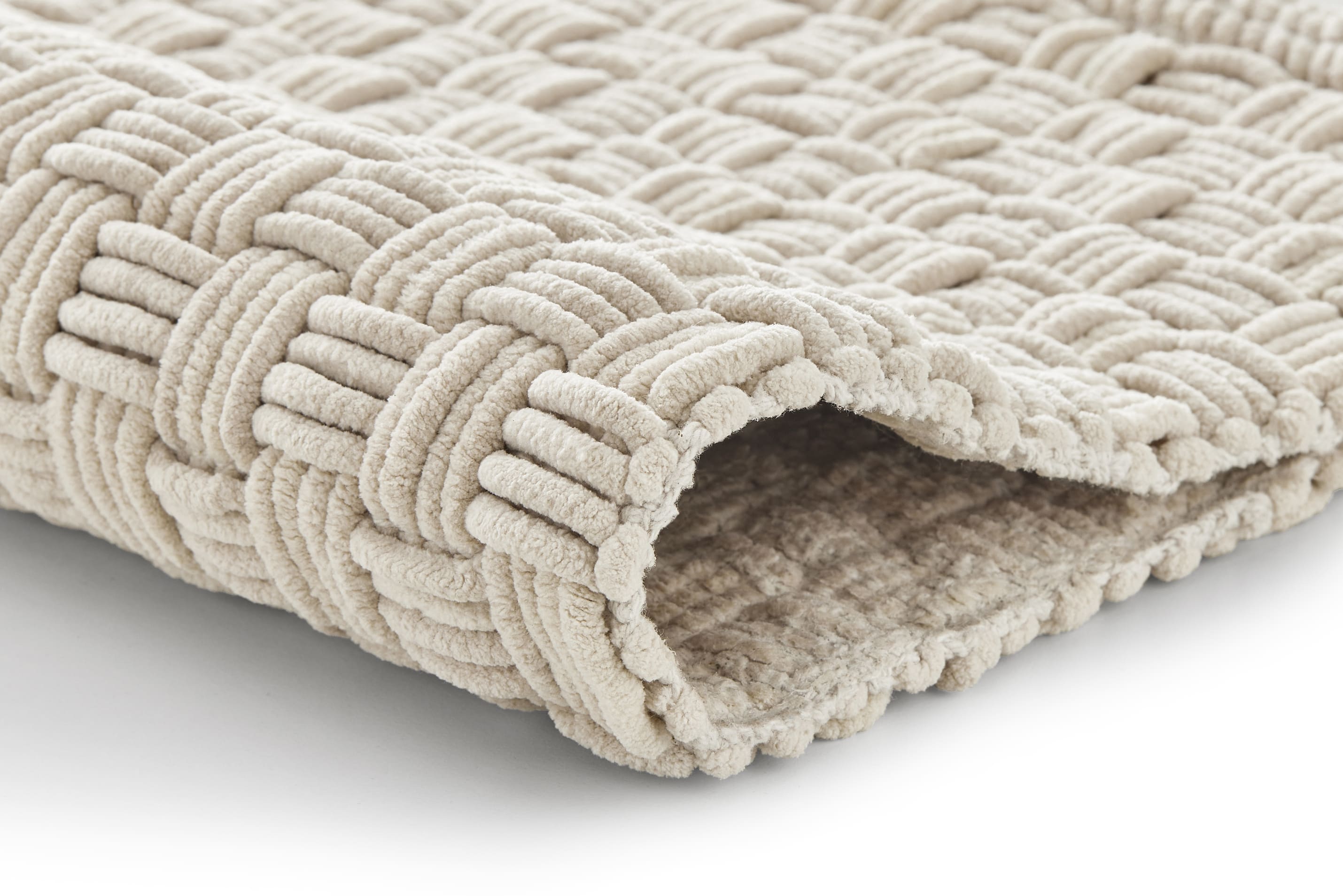 Beige Badematte mit geflochtenem Muster, weiche Textur, ideal für Badezimmer, rutschfest und pflegeleicht.